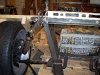 Create initial front strut link lower support 12         