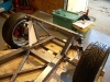 Create initial front strut link lower support 18          