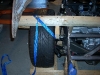 Connect rear strut link to frame 7          